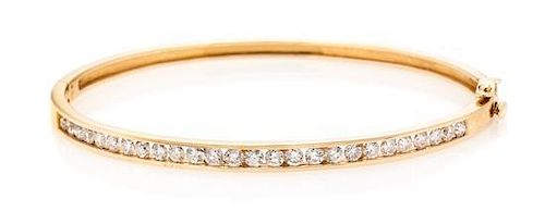 A 14 Karat Rose Gold and Diamond Bangle Bracelet, 8.30 dwts.