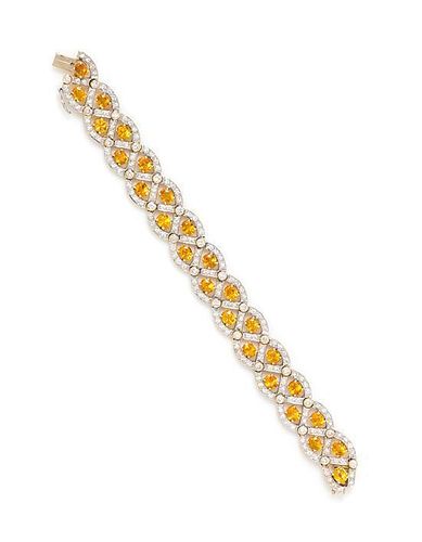 * A Yellow Gold, Yellow Sapphire and Diamond Bracelet, 24.50 dwts.