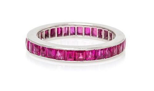 An 18 Karat White Gold and Ruby Eternity Band, 1.80 dwts.