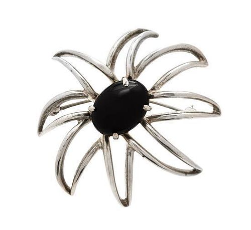 * A Sterling Silver and Onyx Starburst Brooch, Tiffany & Co., 11.10 dwts.