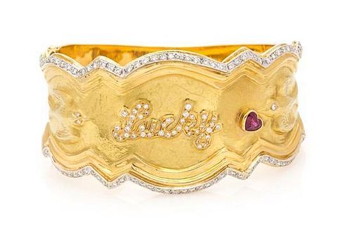 * An 18 Karat Yellow Gold, Diamond and Ruby Cuff Bracelet, 52.30 dwts.