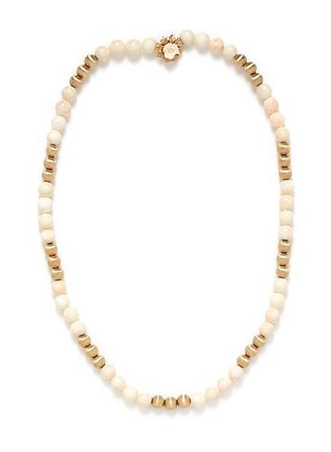 * A 14 Karat Yellow Gold and White Coral Bead Necklace,