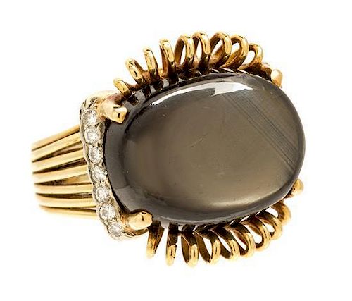 A Yellow Gold, Black Star Sapphire and Diamond Ring 11.70 dwts.