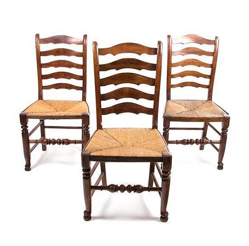 A Set of Six Provincial Oak Ladderback Chairs Height 38 inches.