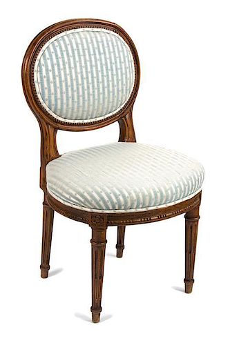 A Louis XVI Style Walnut Diminutive Side Chair Height 27 inches.