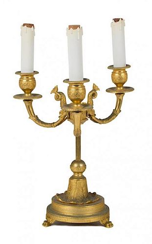 A Continental Gilt Metal Three-Light Candelabrum Height overall 29 inches.