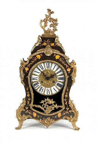 A German Louis XV Style Gilt Metal Mounted Marquetry Shelf Clock Height 22 1/4 inches.