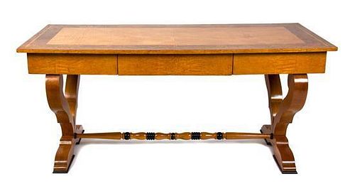 A Biedermeier Birch and Burlwood Writing Table Height 29 3/4 x width 66 x depth 29 1/2 inches.