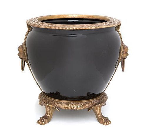 A Gilt Metal Mounted Ceramic Jardinière Height 13 1/2 inches.