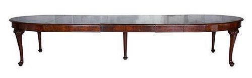 A George III Mahogany Dining Table Height 30 1/2 x width 66 (extending to 138 with leaves) x depth 37 inches.