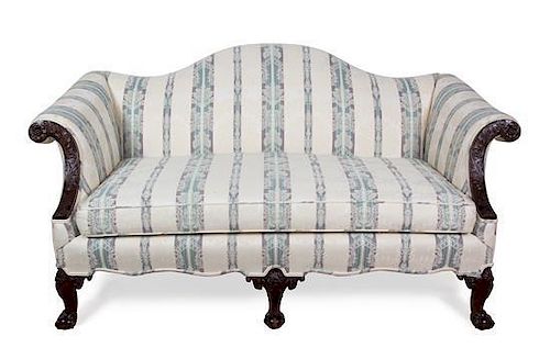 A Chippendale Style Mahogany Camel Back Love Seat Height 34 x width 64 x depth 36 inches.