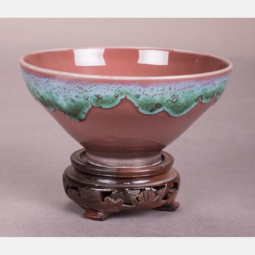 A Chinese Porcelain Bowl with Drip-Glaze Decoration on a Carved Hardwood Stand, 20th Century,