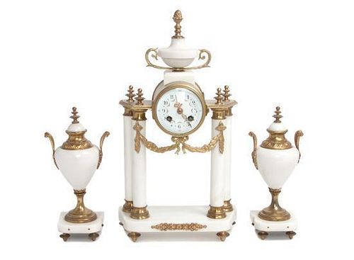 A Three-Piece Marble Clock Garniture Height 16 1/2 inches.