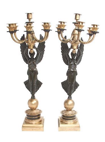 A Pair of Gilt and Patinated Bronze Six-Light Figural Candelabra Height 26 3/4 inches.