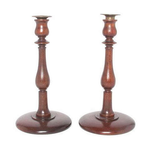 A Pair of Wooden Candlesticks Height 11 inches.