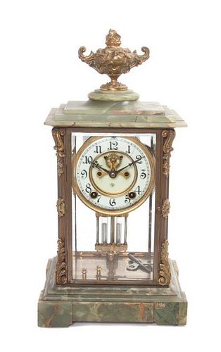 * An American Onyx and Gilt Metal Clock Height 16 inches.