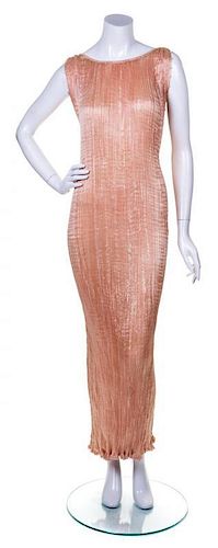 * A Mariano Fortuny Apricot "Delphos" Gown,