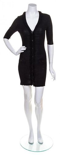 * A Chanel Black Ribbed Cardigan, Size 38.