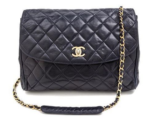 A Chanel Navy Quilted Leather Flap Handbag, 11" x 10" x 3".