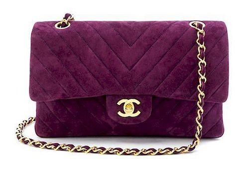 A Chanel Purple Suede Chevron Flap Handbag, 10" x 6.5" x 2.5".
