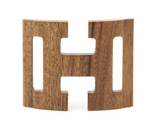An Hermes Logo Wooden Belt Buckle, 3.5" x 2.5".