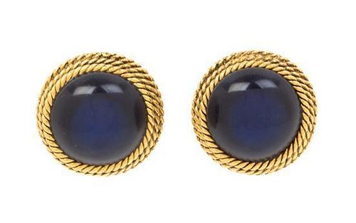 A Pair of Chanel Blue Glass Earclips, 1" x 1".