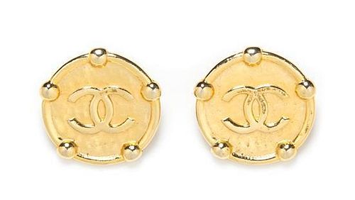 A Pair of Chanel Hammered Goldtone Earclips, 1.5" x 1.5".
