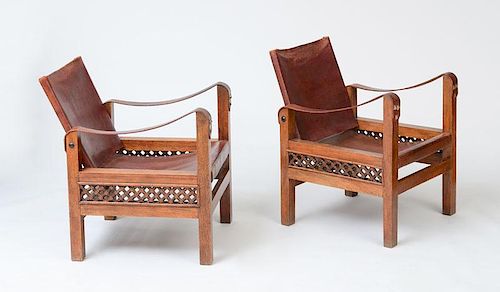 PAIR OF SAFARI" STYLE LEATHER AND STAINED BEECH ARMCHAIRS"