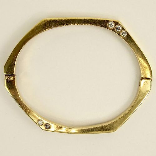 Vintage 14 Karat Yellow Gold Bangle Bracelet accented with Ten (10) Round Cut Diamonds.