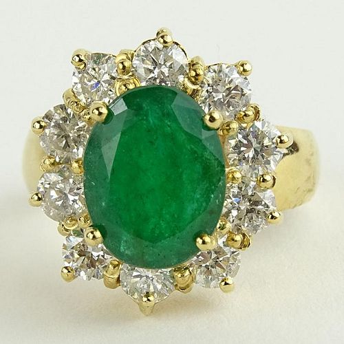 Lady's 4.00 Carat Oval Cut Emerald, 1.80 Carat Round Cut Diamond and 14 Karat Yellow Gold Ring.