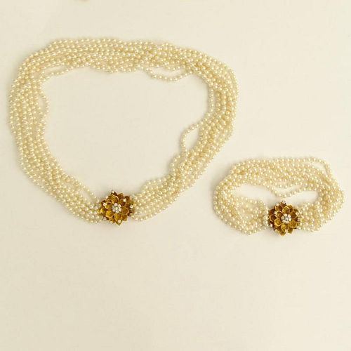 Multi Strand White Pearl Necklace and Bracelet Suite each with 18 Karat Yellow Gold and Diamond Clasp.