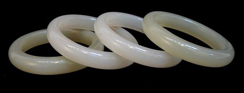Four White And Light Yellow Jade Bangles