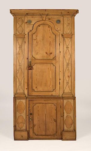 An English George III pine corner cabinet