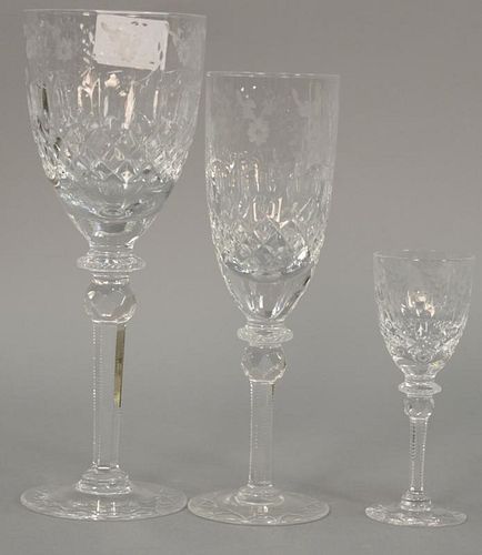 Set of etched glass stems in three different sizes including twelve 9 1/4", twelve 8 1/4", and twelve 5", along with two martini gla...