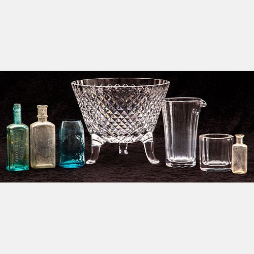 A Group Of Glass Bowls and Bottles
