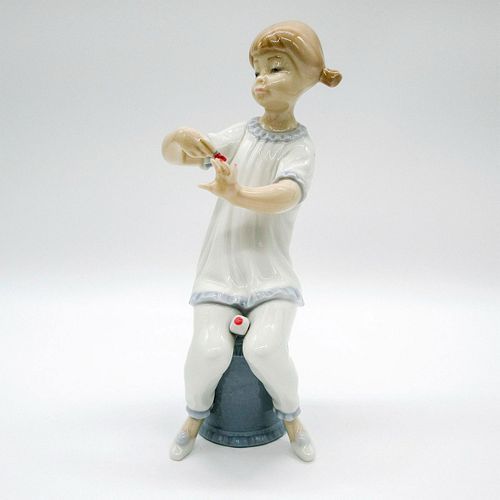 Girl Manicuring 1001082 - Lladro Porcelain Figurine