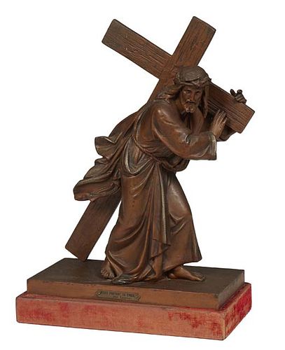 French Patinated Bronze Figure of Jesus Carrying the Cross, 20th c., on an integral base atop a magenta velvet covered wood plinth, Statue- H.- 15 1/4