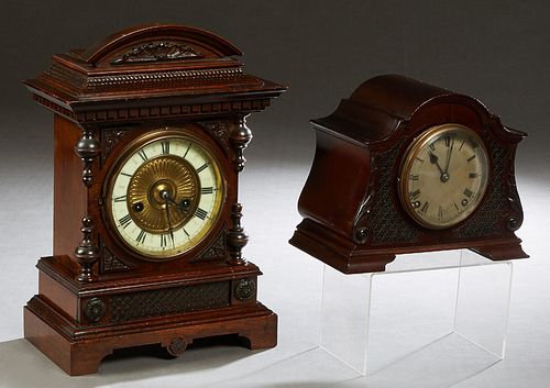 Two Carved Mahogany Mantel Clocks, one a 14 day strike by H.A.C., (Hamburg American Clock Co.) Wurttemberg, with an enamel chapter ring, labeled on th