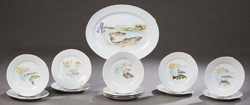 Thirteen Piece French Limoges Porcelain Fish Set, 20th c., by JB, St. Eloi, consisting of twelve circular gilt rimmed plates with transfer fish decora