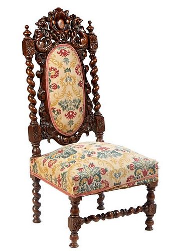 French Henri II Style Carved Oak Side Chair, c. 1880, the arched pierced dragon form crest atop a canted oval cushioned back, flanked by rope twist su