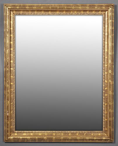 Gilt and Gesso Overmantel Mirror, late 20th c., with a wide rounded frame over a floral relief liner, H.- 49 1/2 in., W.- 39 1/4 in., D.- 2 in.