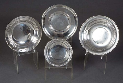 Four Pieces of Sterling Silver, 20th c., consisting of a bread bowl, #037, by Sterling Silver Manufacturing Co., H.- 2 1/2 in., Dia.- 9 1/8 in., Wt.- 