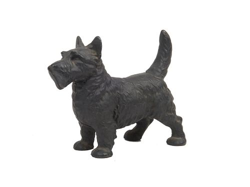 Cast iron door stop Early  20th century American cast iron door stop in the form of a Scottie dog .
Approx 8"h x 10"