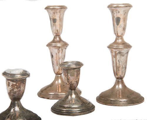 American 20th century sterling candlesticks American 20th century sterling candlesticks weighted.
1st pair approx: 7" h
2nd pair: 3 1/2" h 