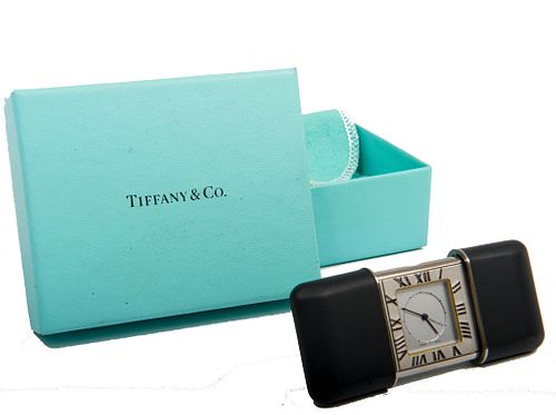 Tiffany & Co travel clock Tiffany & Co Atlas travel alarm clock, compact black leather clad slide cover, Roman numerals.
In original Tiffany bag and 