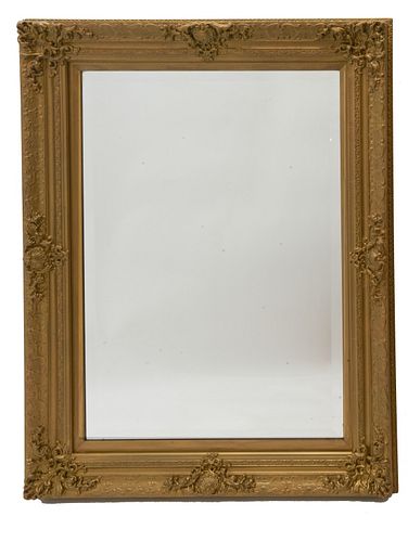 Carved and Gilt wood Mirror French Louis XV style carved gild wood frame and beveled mirror plate 
Approx site size 36" x 24"
Approx overall size 45