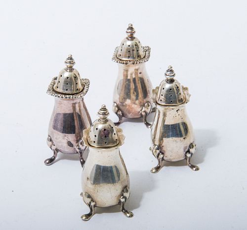 Four sterling silver footed salt & pepper shakers Four sterling silver footed salt & pepper shakers retailed by Tiffany & Co bearing London hallmarks 