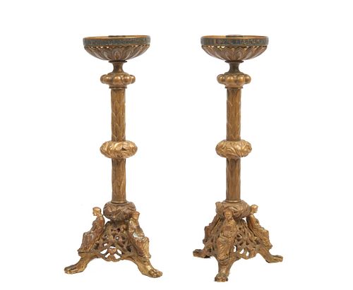Pair of early 20th century bronze Candlesticks Gothic revival patinated bronze candlesticks in the manner of Caldwell are raised on a pierced triparti