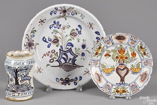 Delft polychrome charger, 18th c., 12 1/4'' dia., together with a plate, 8 3/4'' dia., and a jar