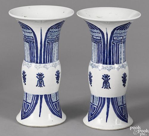 Pair of Chinese blue and white porcelain gu-form vases, having lappet decoration, 11'' h.